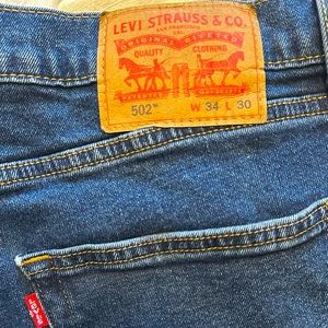 Barely worn Levi 502’s dark blue jeans